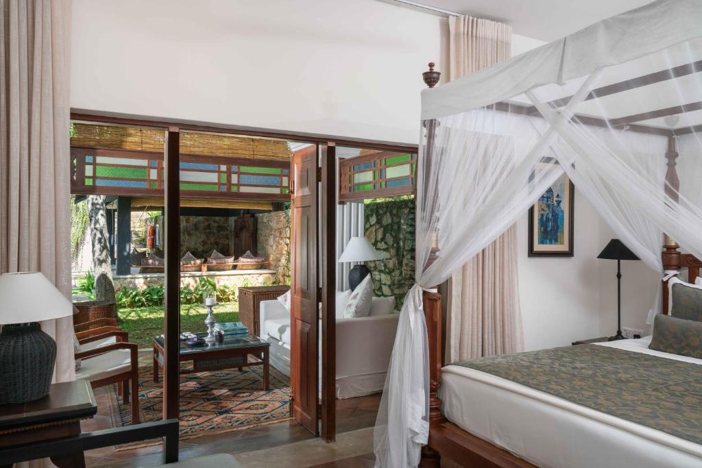 Postel nebo postele na pokoji v ubytování Taru Villas Kandy
