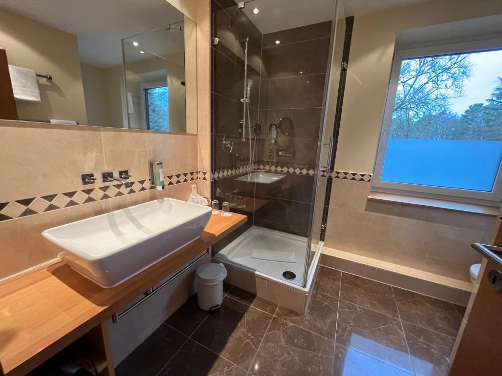 Koupelna v ubytování Hotel Heide Kröpke