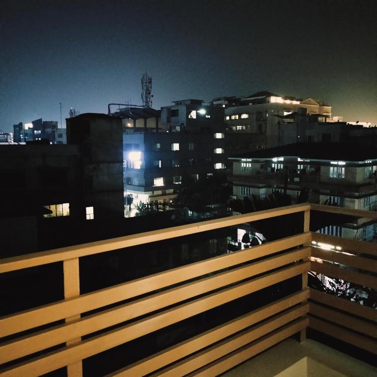 a view of a city at night with buildings at NESTER HOMESTAY in Guwahati