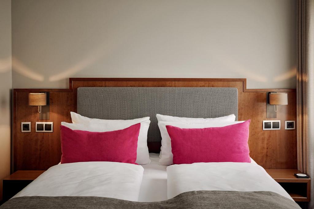 Postel nebo postele na pokoji v ubytování Hotel St. Annen
