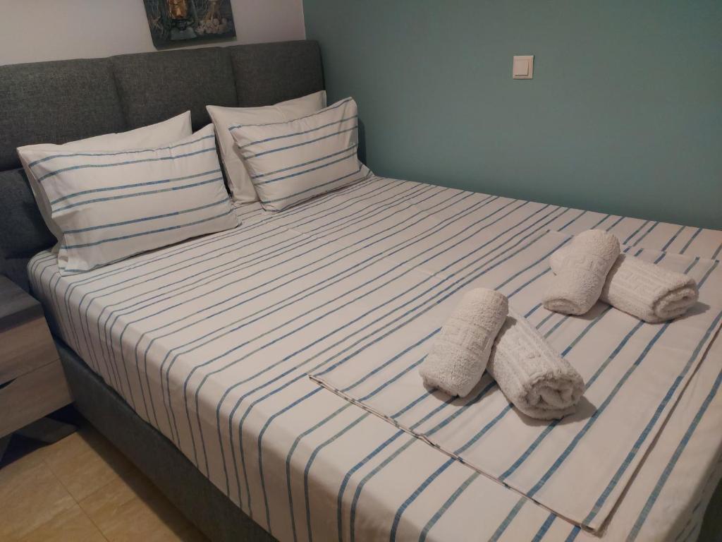 Postel nebo postele na pokoji v ubytování Aktaion Apartments