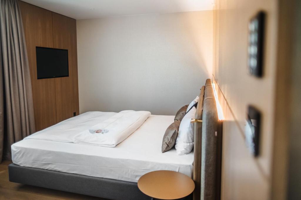 Postel nebo postele na pokoji v ubytování Hotel Meilenstein