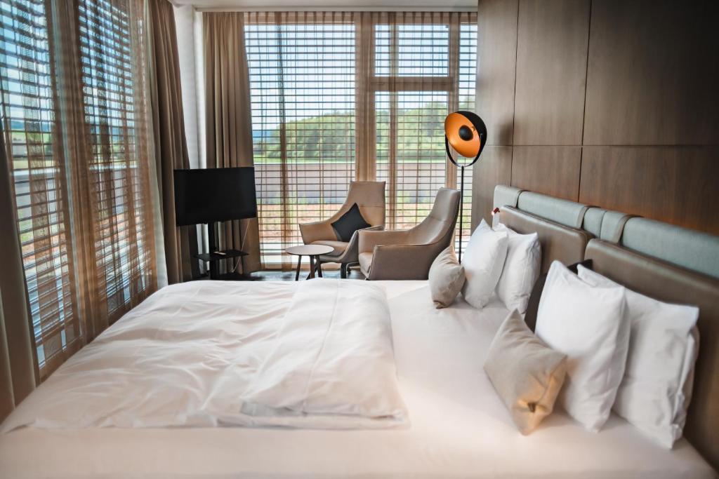 Postel nebo postele na pokoji v ubytování Hotel Meilenstein