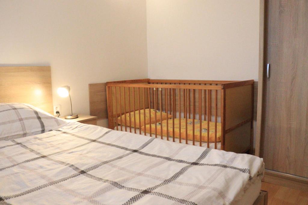 Postel nebo postele na pokoji v ubytování Apartmán L M