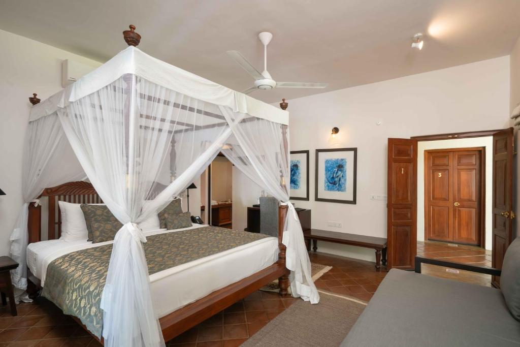Postel nebo postele na pokoji v ubytování Taru Villas Kandy