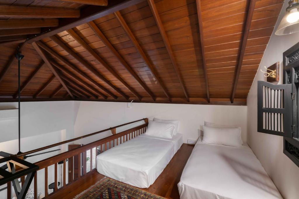 Postel nebo postele na pokoji v ubytování Taru Villas Kandy