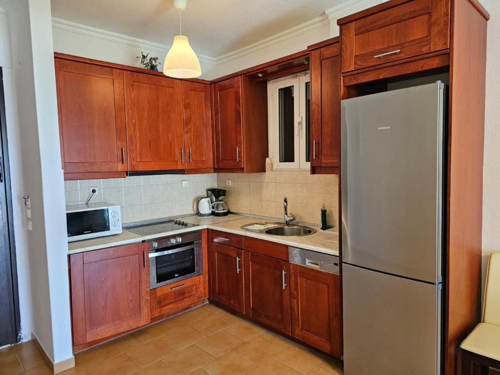 Kuchyňa alebo kuchynka v ubytovaní Glyfada Beachfront Apartment A3g
