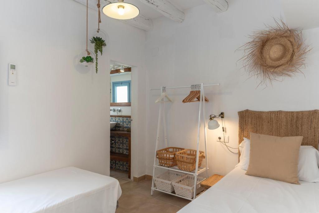 A bed or beds in a room at Casa Azul by Hello Homes Sitges