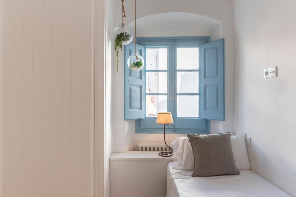 A bed or beds in a room at Casa Azul by Hello Homes Sitges