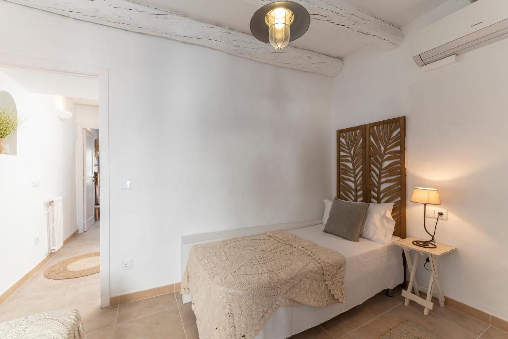 A bed or beds in a room at Casa Azul by Hello Homes Sitges