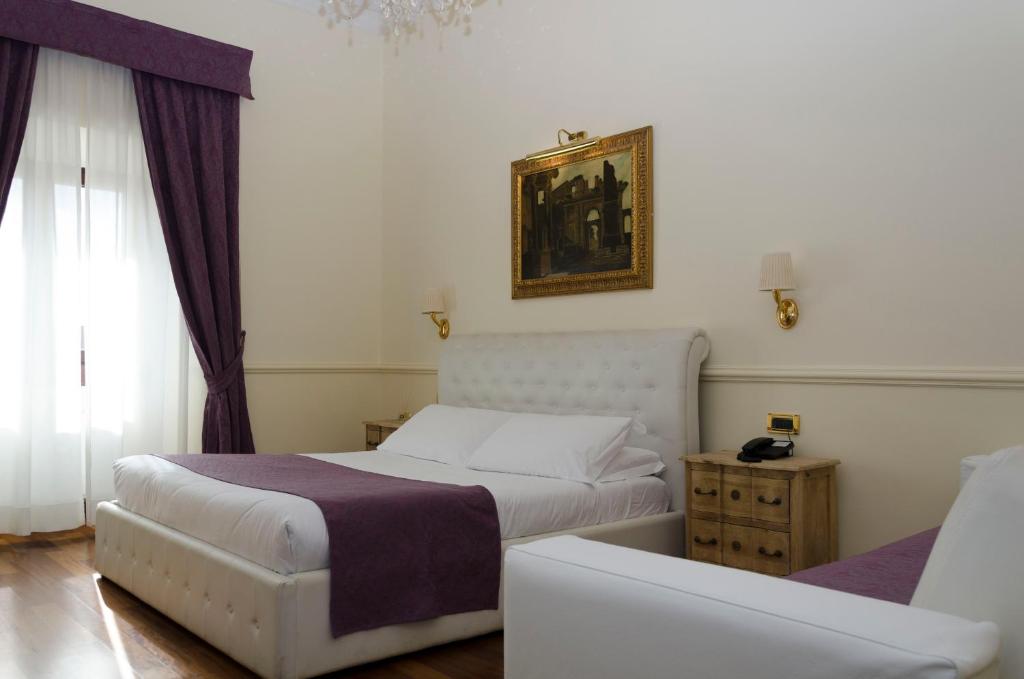 Postel nebo postele na pokoji v ubytování Hotel Traiano