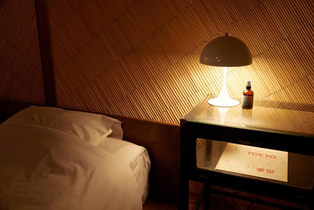 Postel nebo postele na pokoji v ubytování Lhotel de Mai
