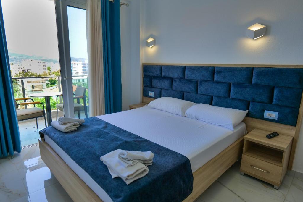 Postel nebo postele na pokoji v ubytování Hotel Vathi