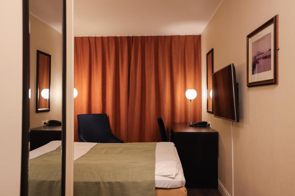 Postel nebo postele na pokoji v ubytování Quality Hotel Florø