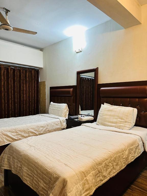 Postel nebo postele na pokoji v ubytování Hotel SeaView 2