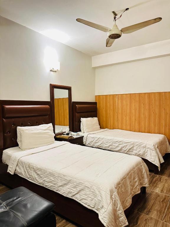 Postel nebo postele na pokoji v ubytování Hotel SeaView 2