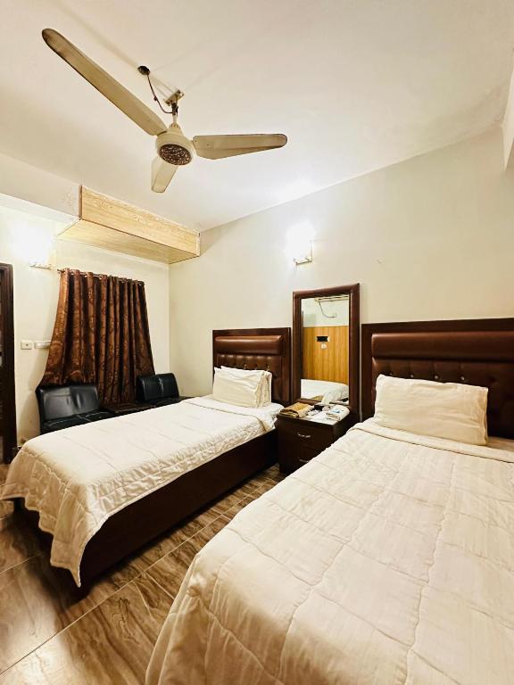 Postel nebo postele na pokoji v ubytování Hotel SeaView 2