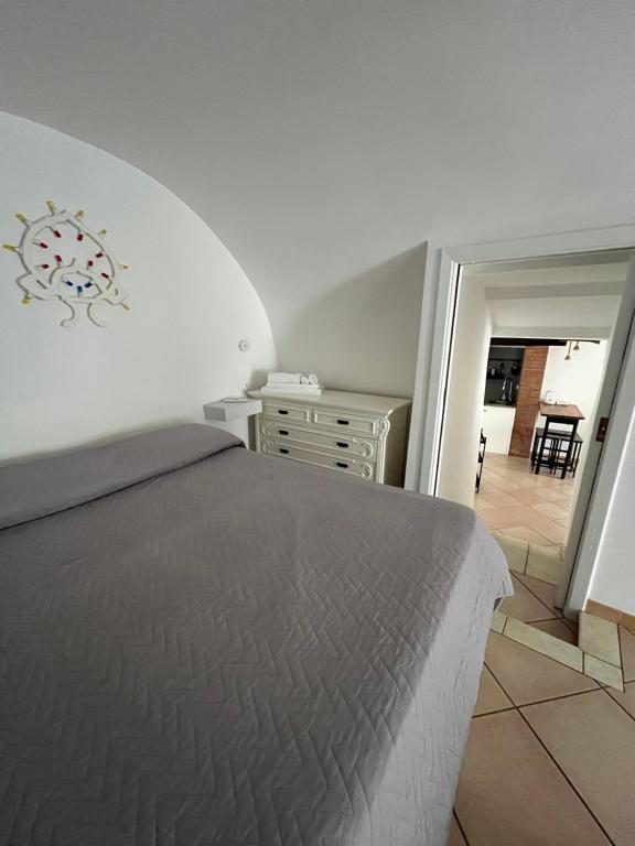 Postel nebo postele na pokoji v ubytování 21mq Suite Homes Ostuni