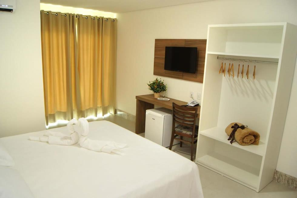 Postel nebo postele na pokoji v ubytování Hotel Flor Da Chapada