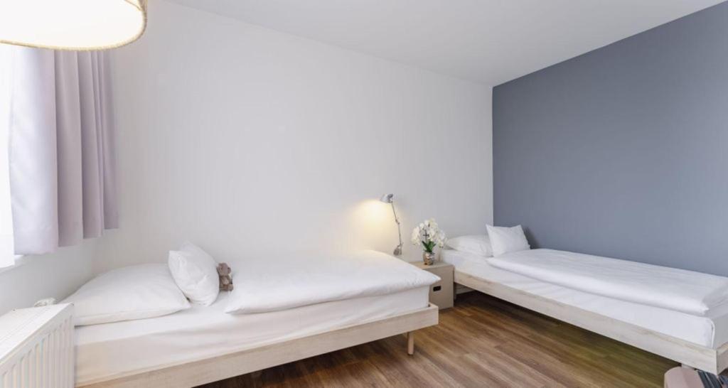 Postel nebo postele na pokoji v ubytování PLAZA INN Wien Gasometer