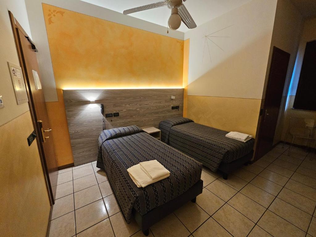 Postel nebo postele na pokoji v ubytování Hotel Euro