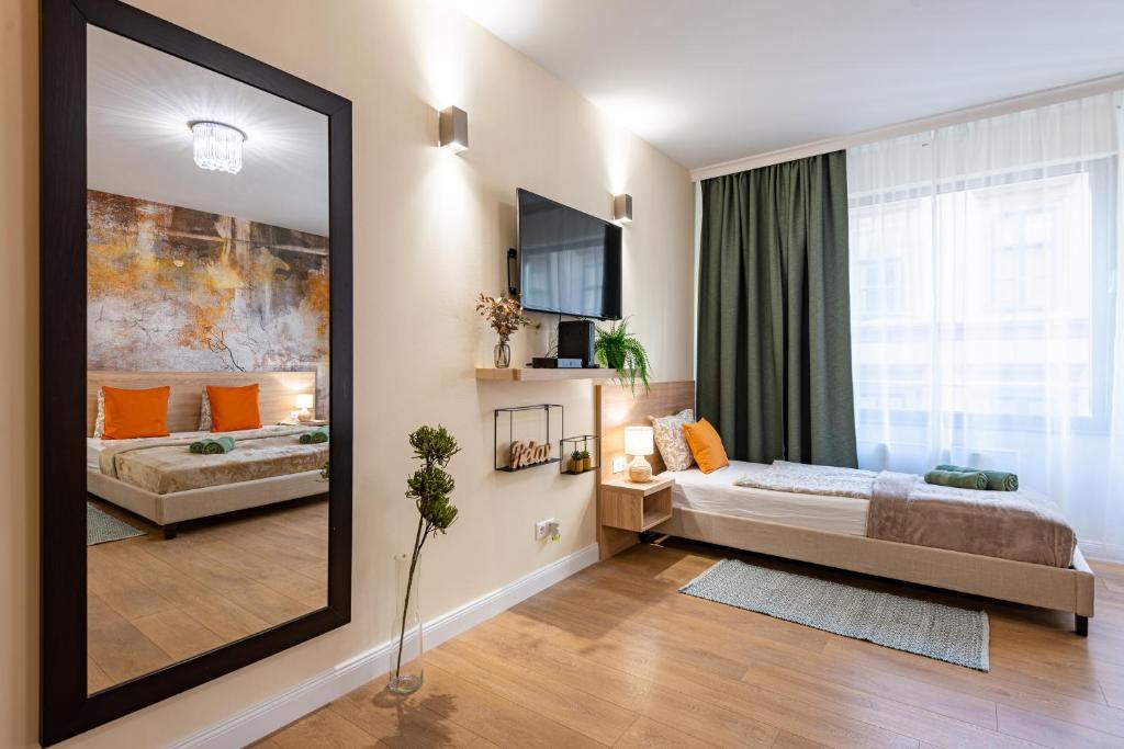 Postel nebo postele na pokoji v ubytování Budapest Holidays Apartments & Spa