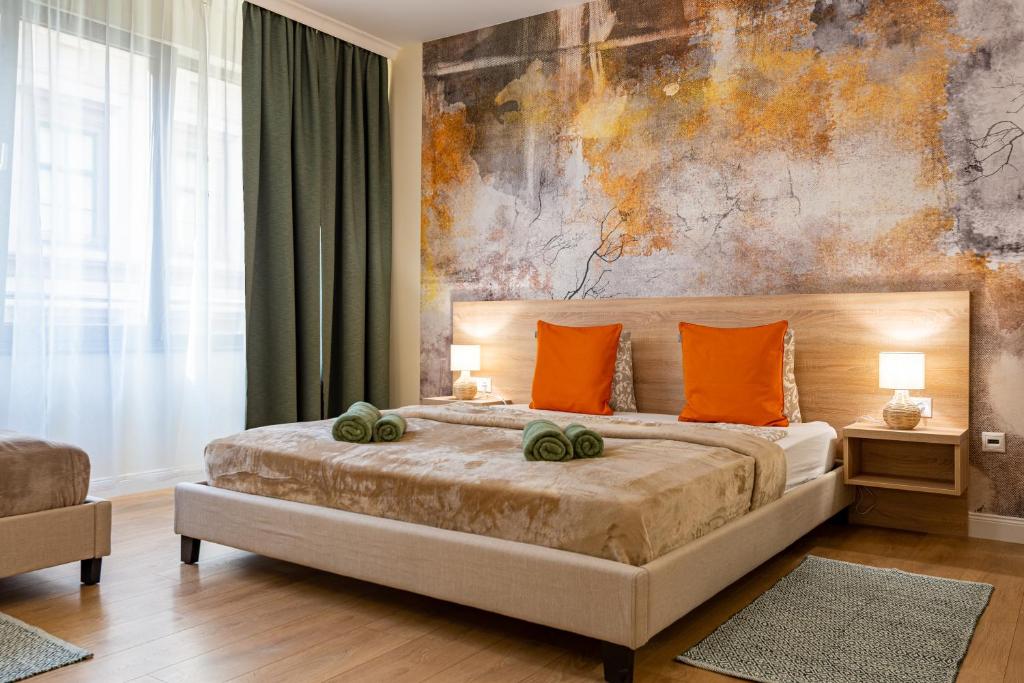 Postel nebo postele na pokoji v ubytování Budapest Holidays Apartments & Spa
