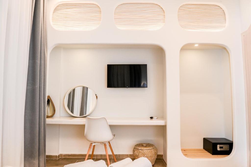 TV a/nebo společenská místnost v ubytování City Center Suites