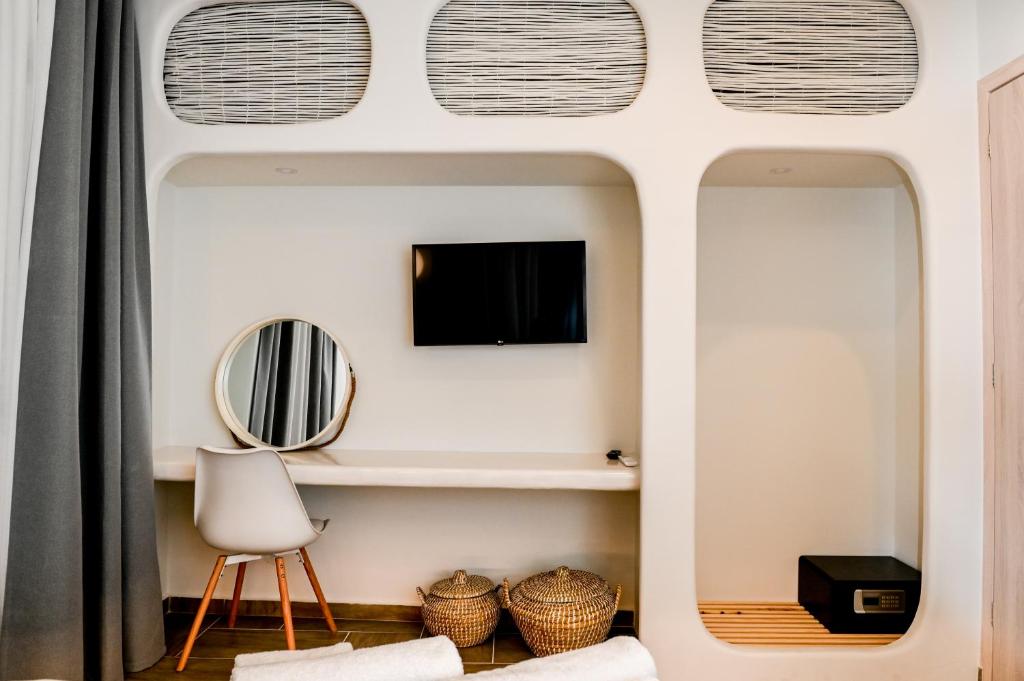 TV a/nebo společenská místnost v ubytování City Center Suites