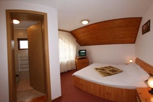 Postel nebo postele na pokoji v ubytování Vila Atena