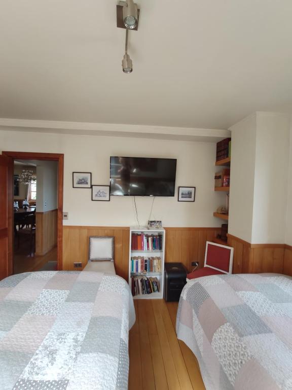 Postel nebo postele na pokoji v ubytování Casa Mia, Puerto Varas, habitación doble
