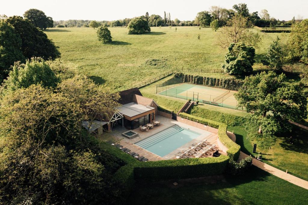 an overhead view of a swimming pool in a field at Talbooth House & Spa in Dedham