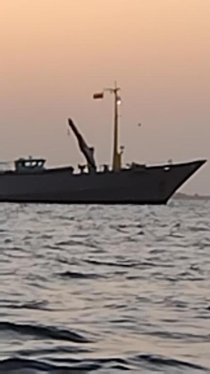 a large boat sitting on the water at Eco hotel summer beach in Cartagena de Indias