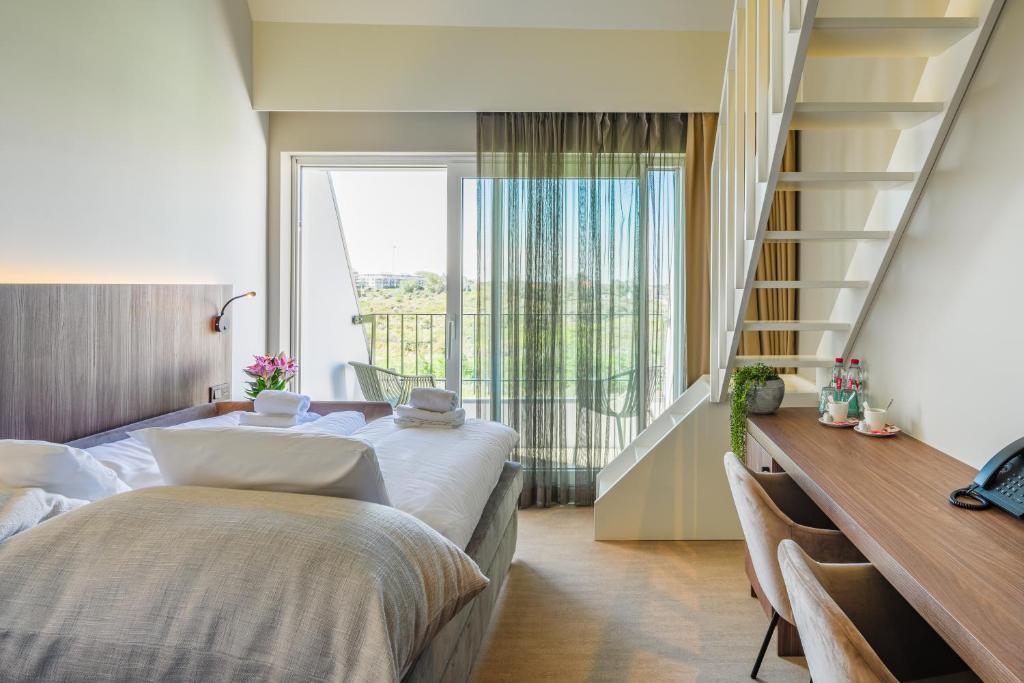Postel nebo postele na pokoji v ubytování Dune Hotel Nieuwpoort