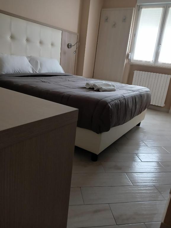A bed or beds in a room at BlueBay Residence Resort