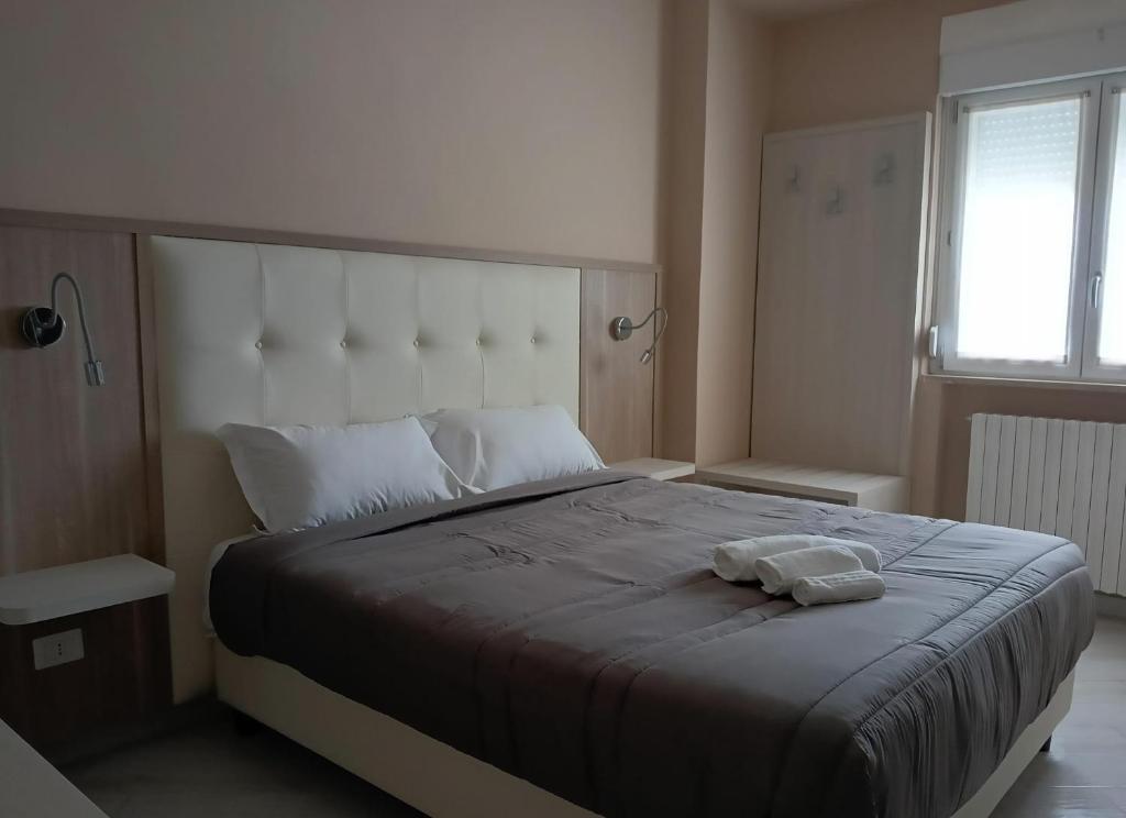 A bed or beds in a room at BlueBay Residence Resort