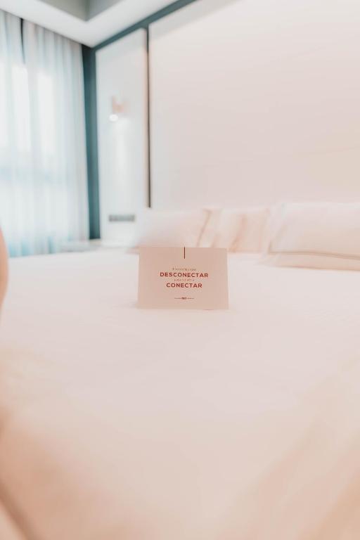 Postel nebo postele na pokoji v ubytování Hotel Málaga Nostrum Airport