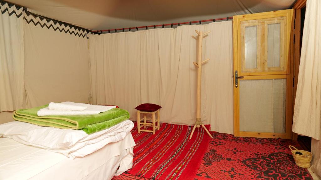 Postel nebo postele na pokoji v ubytování Nomad Camp