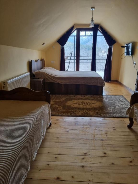 Llit o llits en una habitació de Guest House Sando