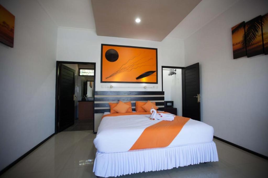 Säng eller sängar i ett rum på melaya beach resort 2