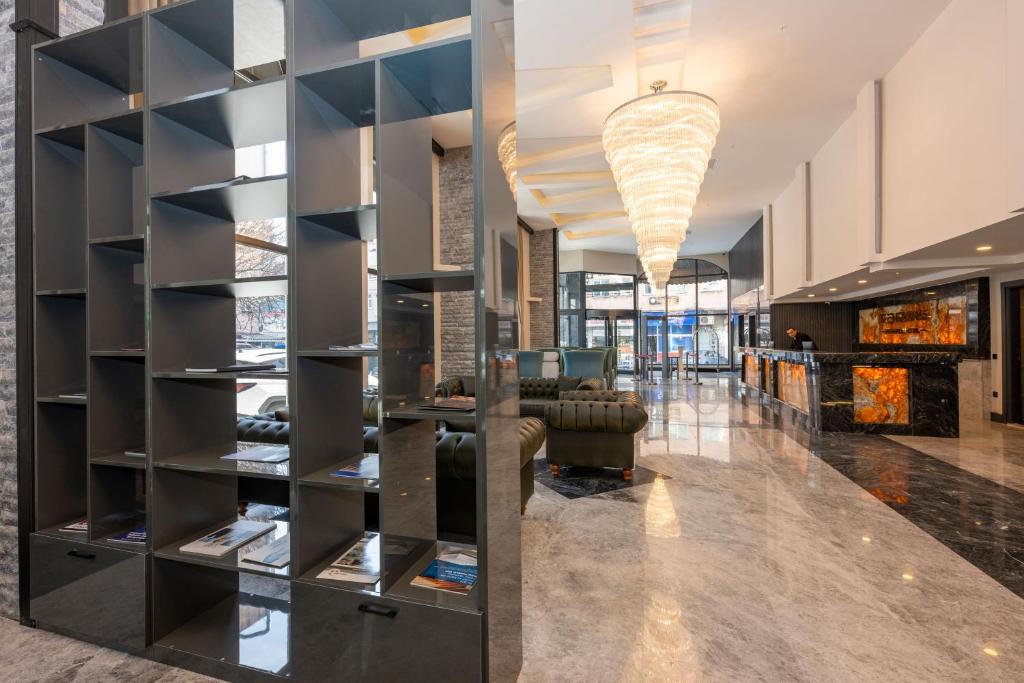 a lobby with a large black display case at The Nirvanas Hotel in Istanbul