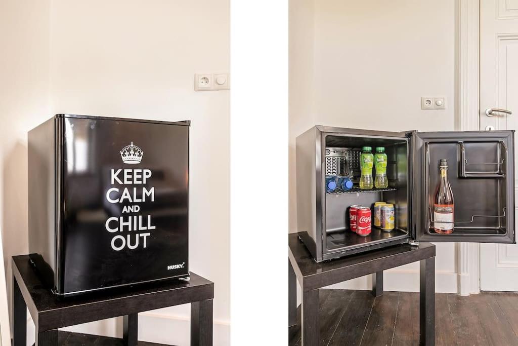 a refrigerator with akeep calm and chill out sign on it at Bohemian Residence in Maastricht