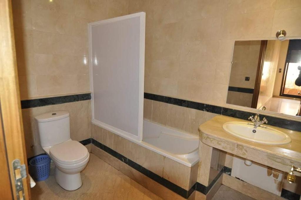 a bathroom with a toilet and a sink at Appartement a Marrakech in Marrakech