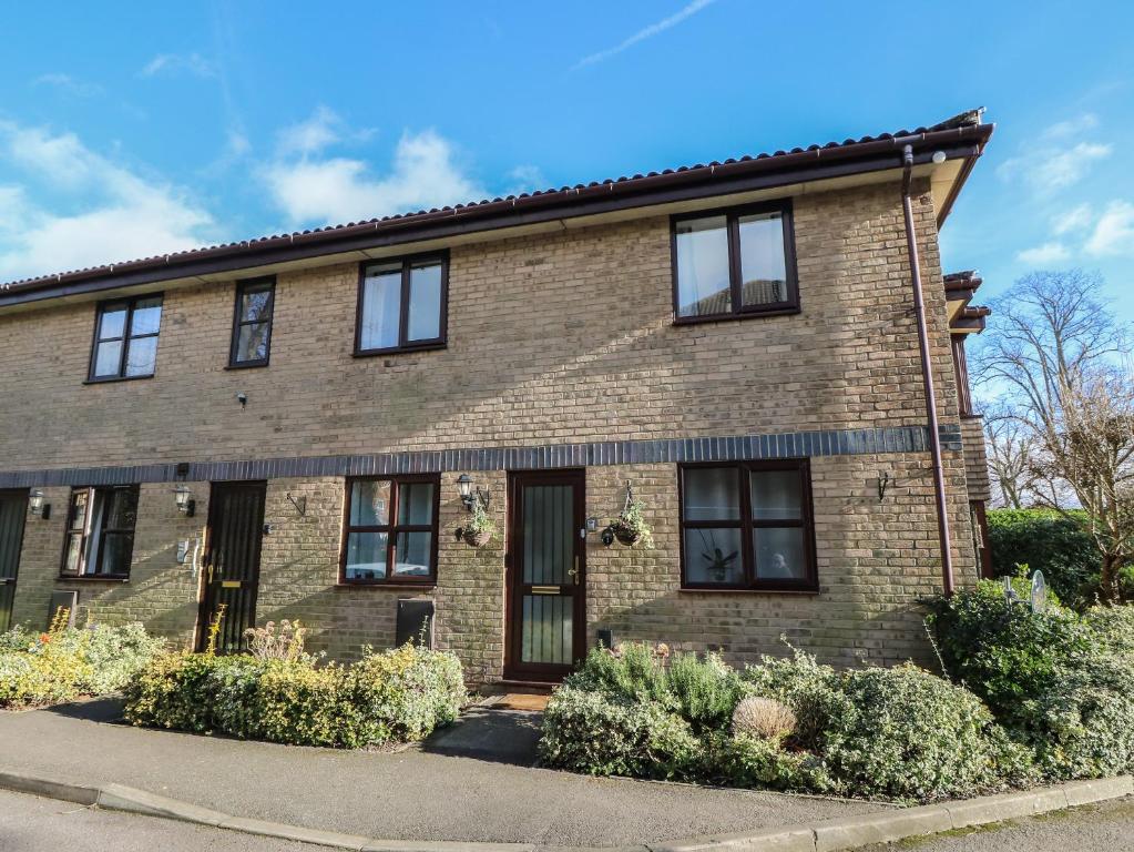 a brick house with black windows at Flat 2, Clifton Gardens in Southampton