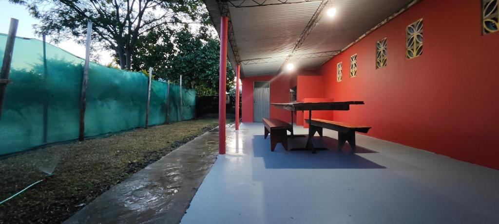 a room with a table and benches in a building at Departamento Bienestar Termas in Federación