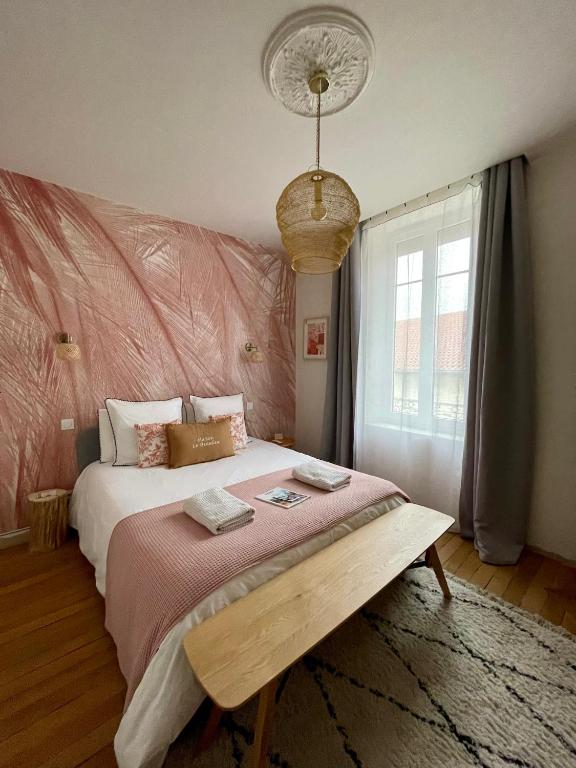 Postel nebo postele na pokoji v ubytování MAISON LE BEAULIEU