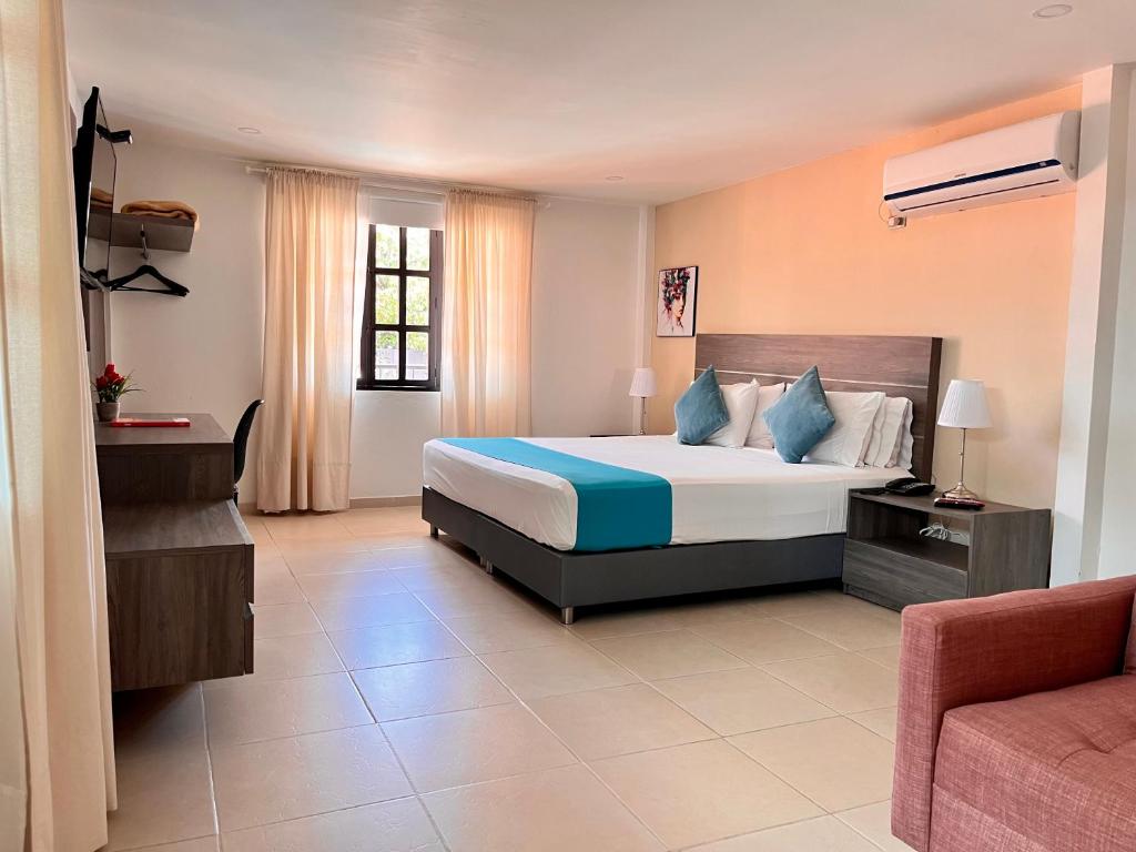 Postel nebo postele na pokoji v ubytování Hotel Vanguardia Natural