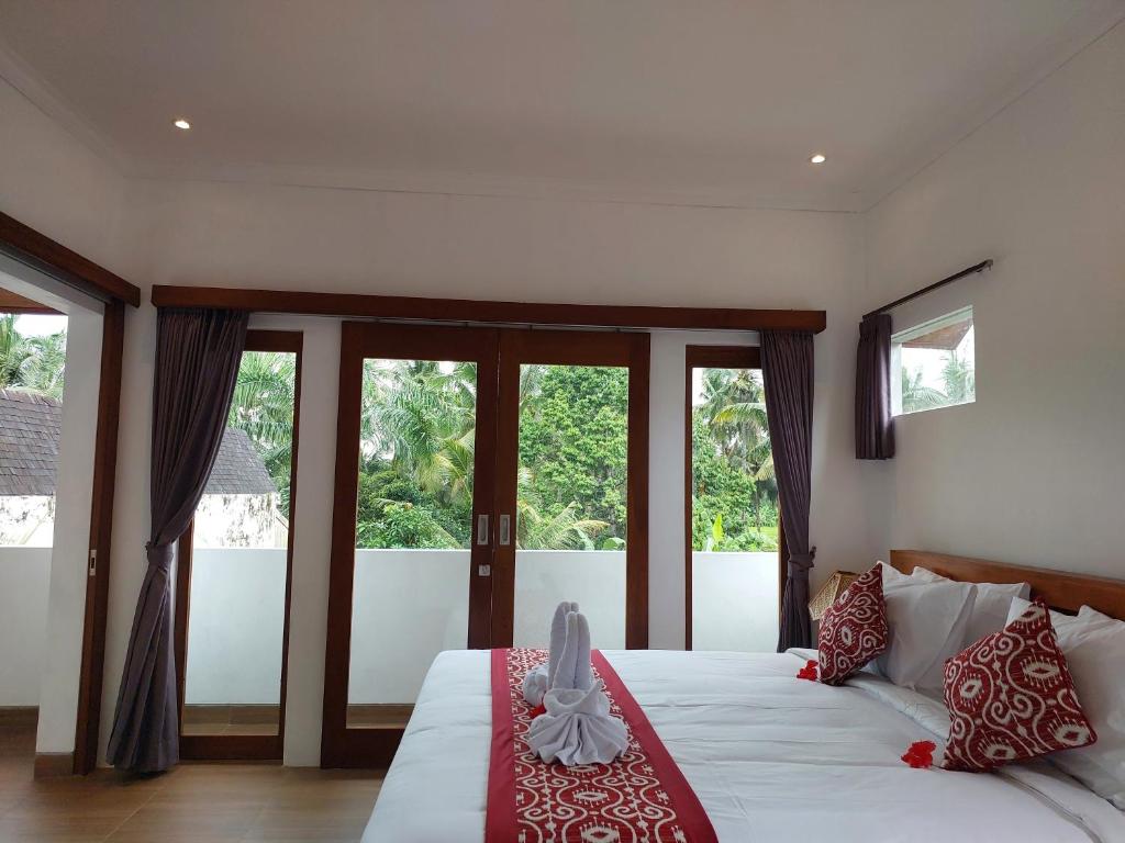 Postel nebo postele na pokoji v ubytování Prema Shiva Suites and Villas by EPS