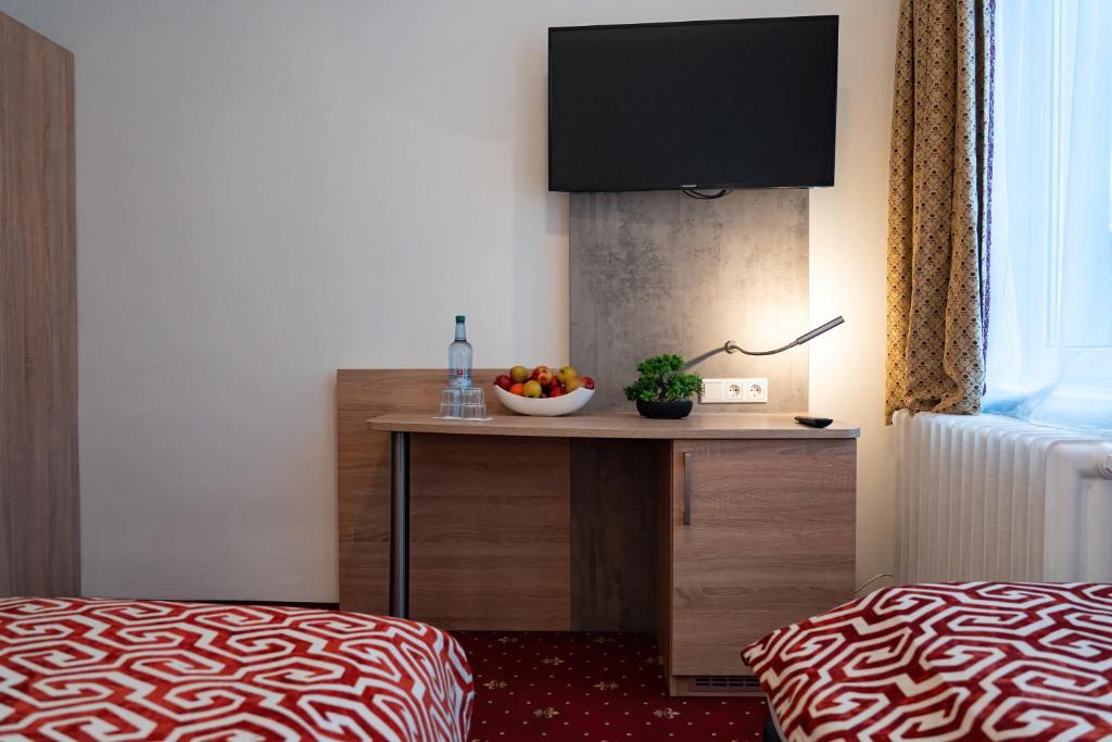 Postel nebo postele na pokoji v ubytování Hotel Stadion Stadt