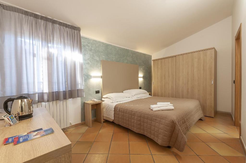 Postel nebo postele na pokoji v ubytování Hotel Sole